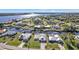 Aerial view of the home and surrounding neighborhood, showcasing waterfront access at 27409 Voyageur Dr, Punta Gorda, FL 33983