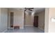 Spacious living room with tiled floors and a ceiling fan at 2813 Starlite Ln, Port Charlotte, FL 33952