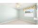 Light and airy bedroom with a ceiling fan and window at 3065 Clifford St, Punta Gorda, FL 33980