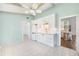 Bright white kitchenette with modern appliances and wood beam ceiling at 3065 Clifford St, Punta Gorda, FL 33980