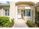 Inviting front entrance with a white door and sidelights at 3132 Silkwood Ln, Port Charlotte, FL 33953