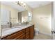 Bathroom with granite double vanity and tile flooring at 3208 Congress St, North Port, FL 34288