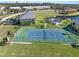 Community tennis court with surrounding green space at 3256 White Ibis Ct # 14 A, Punta Gorda, FL 33950