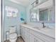 Bathroom with vanity, toilet, and shower at 4195 Surfside Ct, Port Charlotte, FL 33948