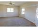 Bright bedroom featuring a ceiling fan and large windows at 53 Callao St, Punta Gorda, FL 33983