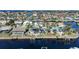 Aerial view showcasing waterfront property with canal access and lush landscaping at 809 Lucia Dr, Punta Gorda, FL 33950