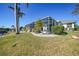Screened-in patio with tropical landscaping at 809 Lucia Dr, Punta Gorda, FL 33950