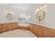 Elegant bathroom with corner soaking tub, double vanity, and updated fixtures at 809 Lucia Dr, Punta Gorda, FL 33950