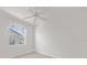 Bright bedroom with ceiling fan, window treatments and laminate flooring at 809 Lucia Dr, Punta Gorda, FL 33950