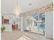 Dining room with pool view and access to patio at 809 Lucia Dr, Punta Gorda, FL 33950