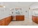 Modern kitchen with stainless steel appliances and light wood cabinets at 809 Lucia Dr, Punta Gorda, FL 33950