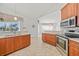 Kitchen features stainless steel appliances and wood cabinets at 809 Lucia Dr, Punta Gorda, FL 33950