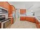Spacious kitchen with stainless steel appliances and wood cabinets at 809 Lucia Dr, Punta Gorda, FL 33950