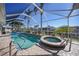 Enjoy this gorgeous screened pool and spa at 809 Lucia Dr, Punta Gorda, FL 33950