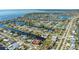 Wide aerial showcasing the home's location in a waterfront community at 108 Roselle Ct, Port Charlotte, FL 33952