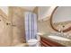 Bathroom with shower, granite countertop, and decorative shower curtain at 108 Roselle Ct, Port Charlotte, FL 33952