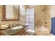 Bathroom with shower/tub combo, granite vanity, and tile flooring at 108 Roselle Ct, Port Charlotte, FL 33952