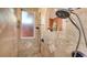 Large walk-in shower with dual shower heads and neutral tile at 108 Roselle Ct, Port Charlotte, FL 33952