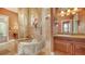 Bathroom with soaking tub, double vanity and elegant tile at 108 Roselle Ct, Port Charlotte, FL 33952