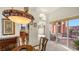 Sunlit dining room with glass doors leading to a private courtyard at 108 Roselle Ct, Port Charlotte, FL 33952