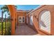 Elegant entryway with arched details and a beautiful wooden door at 108 Roselle Ct, Port Charlotte, FL 33952