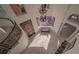 Bright two-story foyer with a spiral staircase and elegant chandelier at 108 Roselle Ct, Port Charlotte, FL 33952