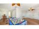 Bright game room features foosball table, hardwood floors, and ceiling fans at 108 Roselle Ct, Port Charlotte, FL 33952