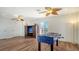 Game room with foosball table, hardwood floors, and built-in entertainment center at 108 Roselle Ct, Port Charlotte, FL 33952