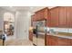 Bright kitchen with stainless steel refrigerator and granite countertops at 108 Roselle Ct, Port Charlotte, FL 33952