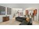 Open floor plan living room with sectional sofa and kitchen access at 108 Roselle Ct, Port Charlotte, FL 33952