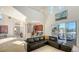 Open living area with a comfortable sectional sofa and kitchen views at 108 Roselle Ct, Port Charlotte, FL 33952