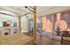 Main bedroom with private courtyard access and a large four poster bed at 108 Roselle Ct, Port Charlotte, FL 33952
