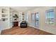 Home office with built-in shelving, hardwood floors, and access to balcony at 108 Roselle Ct, Port Charlotte, FL 33952
