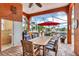 Covered patio with outdoor kitchen, dining area, and water views at 108 Roselle Ct, Port Charlotte, FL 33952