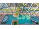 Overlooking a luxurious pool and spa with brick patio at 108 Roselle Ct, Port Charlotte, FL 33952