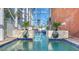 Relaxing pool area with lion head fountains and lush landscaping at 108 Roselle Ct, Port Charlotte, FL 33952