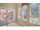 Sunroom featuring French doors and arched windows at 108 Roselle Ct, Port Charlotte, FL 33952