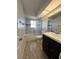 Bathroom with subway tile, a shower/tub combo and dark vanity at 1196 Hinton St, Port Charlotte, FL 33952
