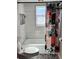 Bright bathroom with a tub, shower, and patterned floor tiles at 1196 Hinton St, Port Charlotte, FL 33952