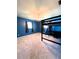 Bedroom with blue walls, carpet flooring, and a built-in bunk bed at 1196 Hinton St, Port Charlotte, FL 33952