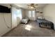 Spacious bedroom with two beds, a ceiling fan, and a window at 1196 Hinton St, Port Charlotte, FL 33952