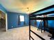 Bedroom with blue walls, carpet flooring, and a built-in bunk bed at 1196 Hinton St, Port Charlotte, FL 33952