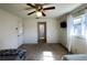 Well-lit bedroom with a ceiling fan and access to the bathroom at 1196 Hinton St, Port Charlotte, FL 33952