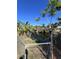 Peaceful waterfront view with mature tropical plants at 1196 Hinton St, Port Charlotte, FL 33952