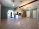 Open concept dining area with tile floors and kitchen view at 1196 Hinton St, Port Charlotte, FL 33952