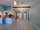 Bright dining area with tile floors and stylish light fixtures at 1196 Hinton St, Port Charlotte, FL 33952