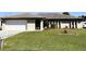 Single-story house with attached garage and well-maintained lawn at 1196 Hinton St, Port Charlotte, FL 33952
