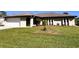 House exterior showing front yard and attached garage at 1196 Hinton St, Port Charlotte, FL 33952