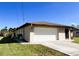 Attached garage with white door and ample space at 1196 Hinton St, Port Charlotte, FL 33952