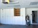 Garage with ample storage cabinets and shelving at 1196 Hinton St, Port Charlotte, FL 33952